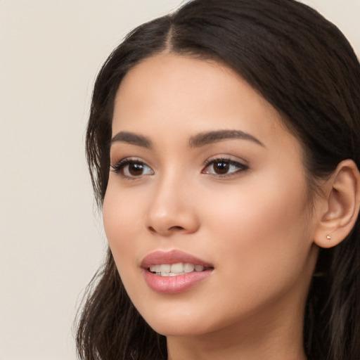 Joyful white young-adult female with long  black hair and brown eyes