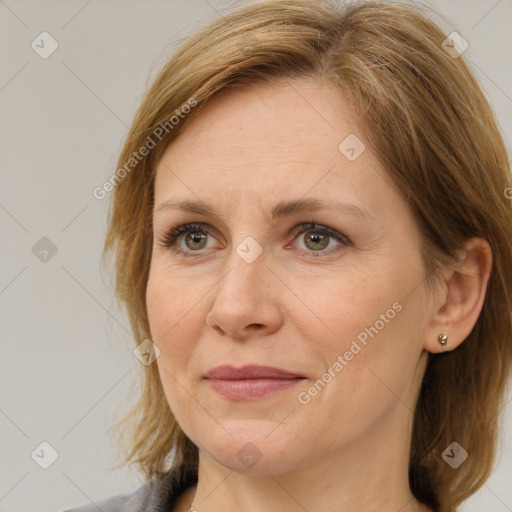 Joyful white adult female with medium  brown hair and brown eyes