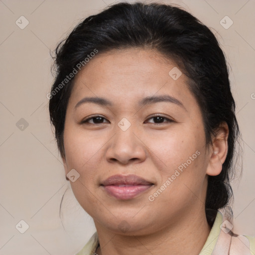 Joyful asian adult female with medium  brown hair and brown eyes