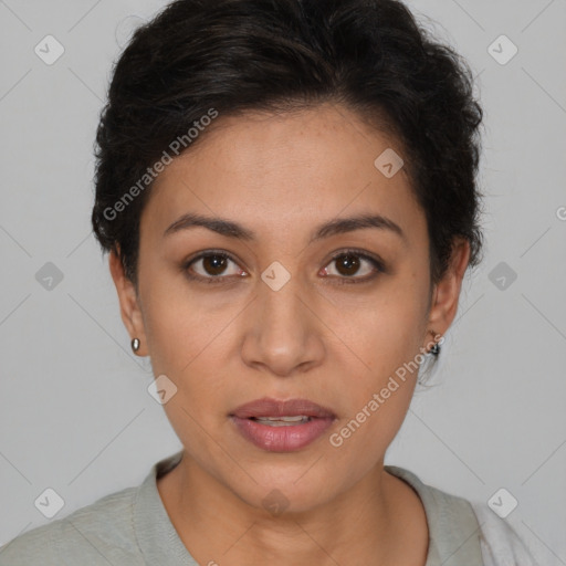 Joyful latino young-adult female with short  brown hair and brown eyes