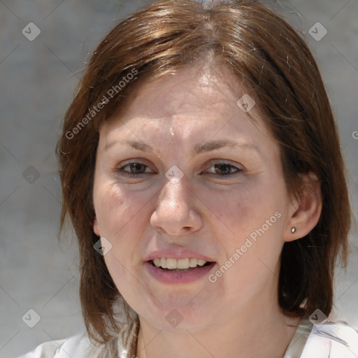 Joyful white adult female with medium  brown hair and blue eyes