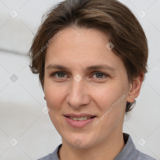 Joyful white adult female with short  brown hair and grey eyes