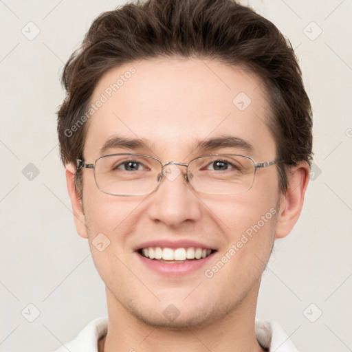 Joyful white adult male with short  brown hair and grey eyes