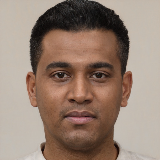 Neutral latino young-adult male with short  black hair and brown eyes