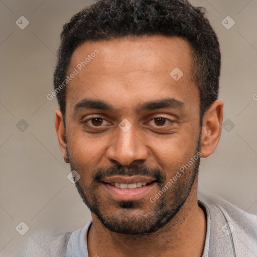 Joyful black young-adult male with short  black hair and brown eyes