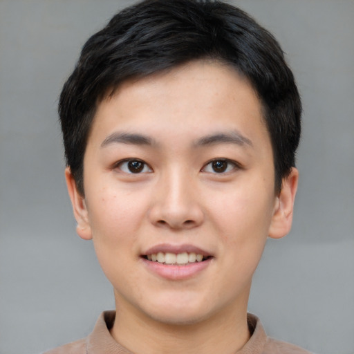 Joyful asian young-adult female with short  brown hair and brown eyes