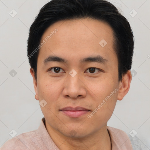 Joyful asian young-adult male with short  brown hair and brown eyes