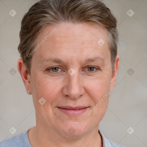 Joyful white adult female with short  brown hair and grey eyes