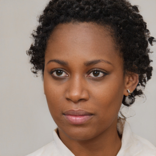 Neutral black young-adult female with short  brown hair and brown eyes