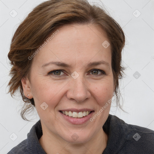 Joyful white adult female with medium  brown hair and grey eyes