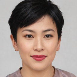 Joyful asian young-adult female with short  brown hair and brown eyes