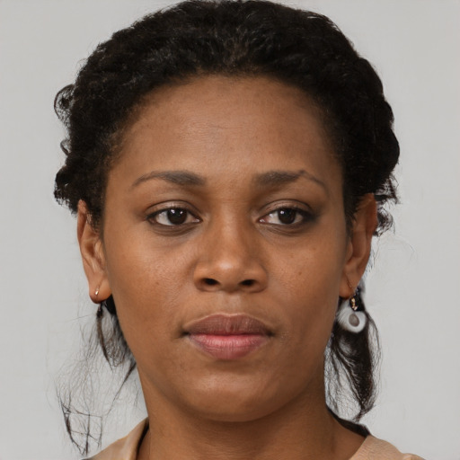 Neutral black adult female with short  brown hair and brown eyes