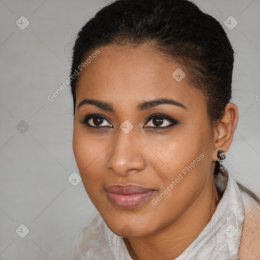 Joyful black young-adult female with short  black hair and brown eyes