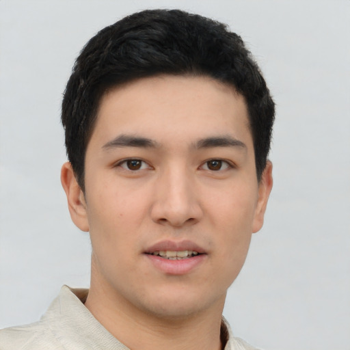 Joyful asian young-adult male with short  black hair and brown eyes