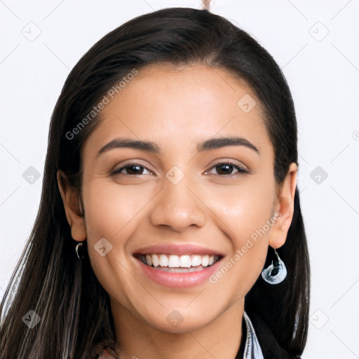 Joyful latino young-adult female with long  brown hair and brown eyes