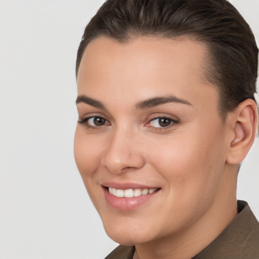 Joyful white young-adult female with short  brown hair and brown eyes