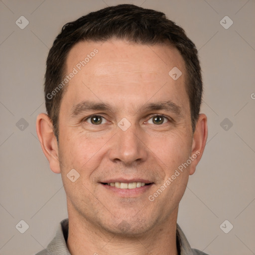 Joyful white adult male with short  brown hair and brown eyes