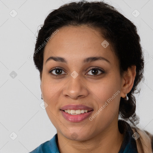 Joyful latino young-adult female with long  brown hair and brown eyes