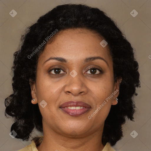 Joyful black adult female with medium  brown hair and brown eyes