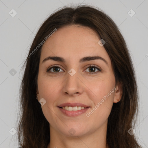 Joyful white young-adult female with long  brown hair and brown eyes