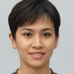 Joyful asian young-adult female with short  brown hair and brown eyes