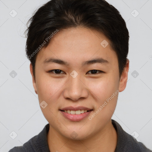 Joyful asian young-adult female with short  brown hair and brown eyes