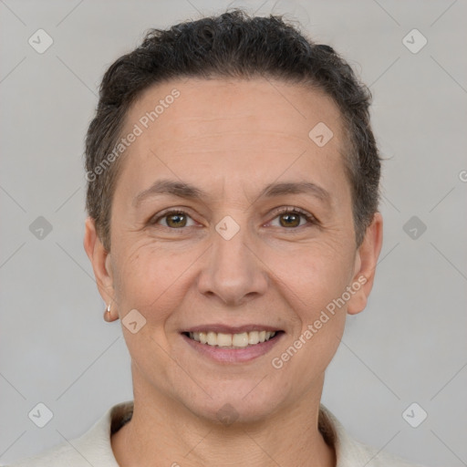 Joyful white adult female with short  brown hair and brown eyes