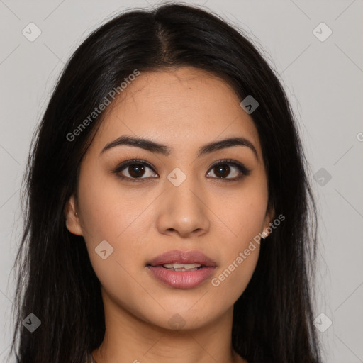 Joyful latino young-adult female with long  brown hair and brown eyes