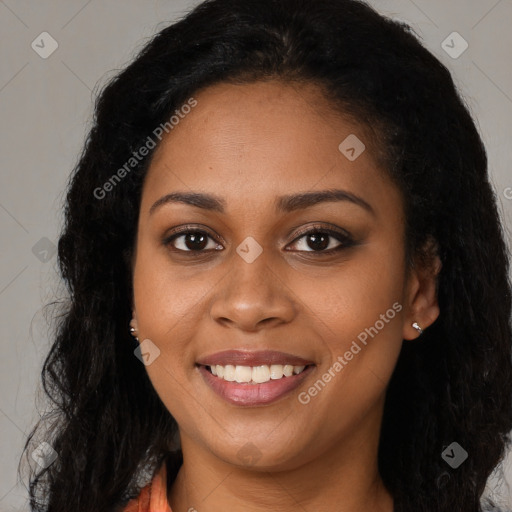 Joyful black young-adult female with long  brown hair and brown eyes