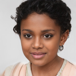 Joyful black child female with short  brown hair and brown eyes