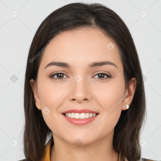 Joyful white young-adult female with long  brown hair and brown eyes