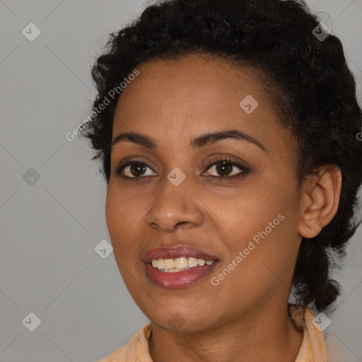 Joyful black young-adult female with medium  black hair and brown eyes