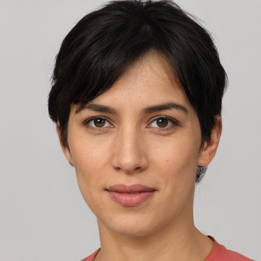 Joyful white young-adult female with short  brown hair and brown eyes