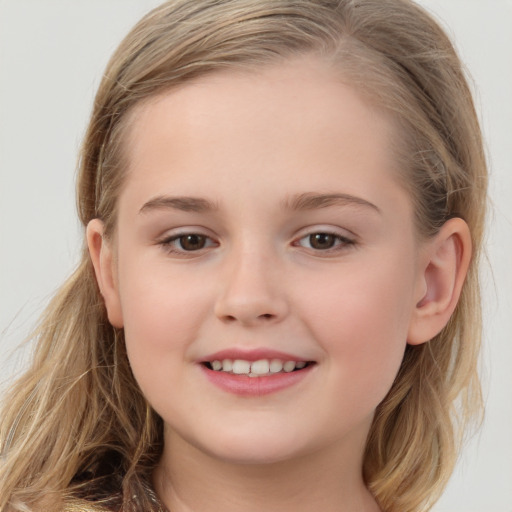 Joyful white child female with medium  brown hair and brown eyes