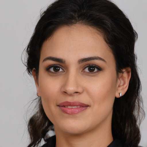 Joyful white young-adult female with medium  brown hair and brown eyes