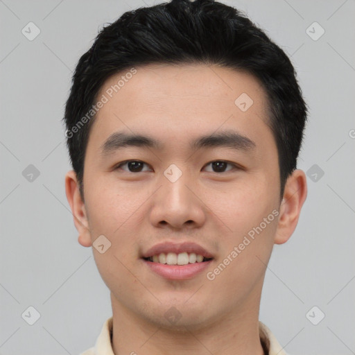 Joyful asian young-adult male with short  black hair and brown eyes