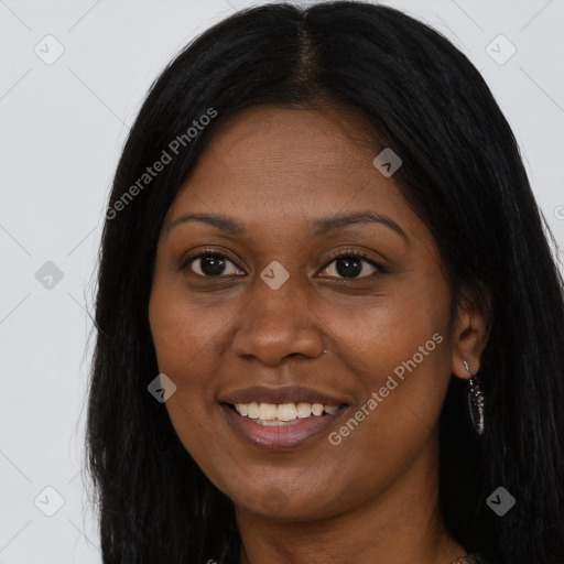 Joyful black young-adult female with long  brown hair and brown eyes