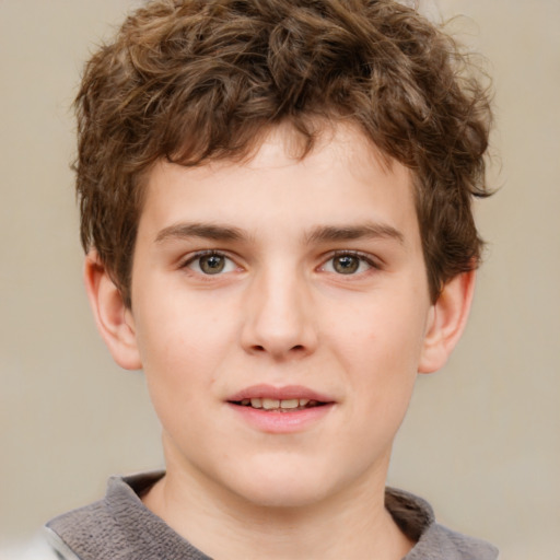 Joyful white child male with short  brown hair and grey eyes