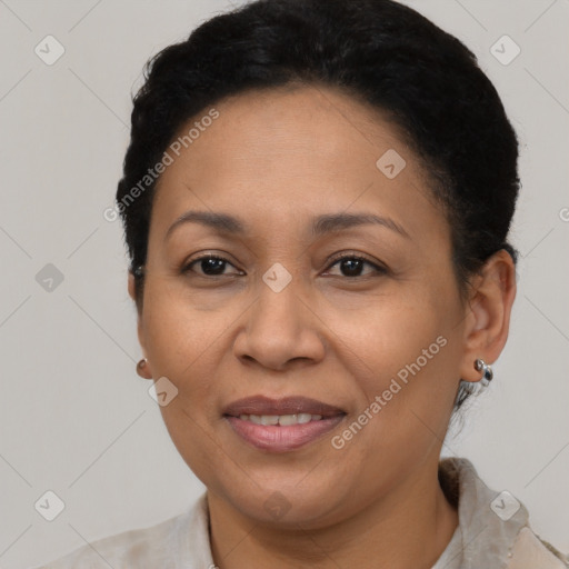 Joyful latino adult female with short  brown hair and brown eyes