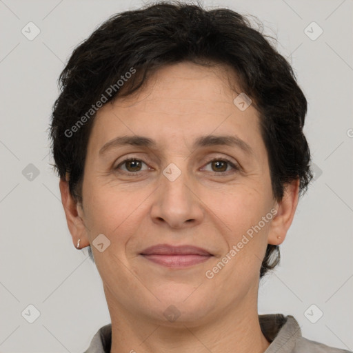 Joyful white adult female with short  brown hair and brown eyes