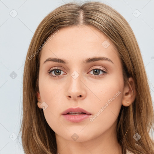 Neutral white young-adult female with long  brown hair and brown eyes