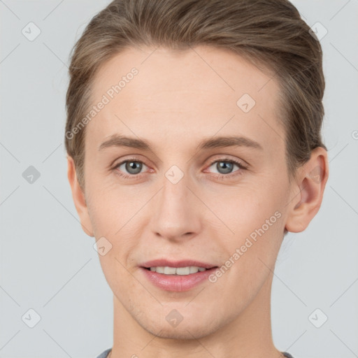 Joyful white young-adult female with short  brown hair and grey eyes