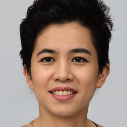 Joyful asian young-adult female with short  black hair and brown eyes