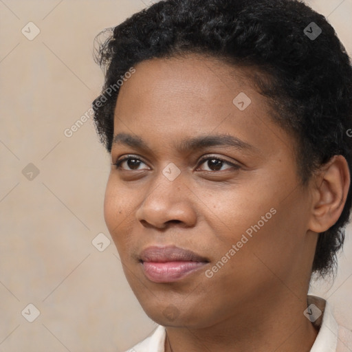 Joyful black young-adult female with short  black hair and brown eyes