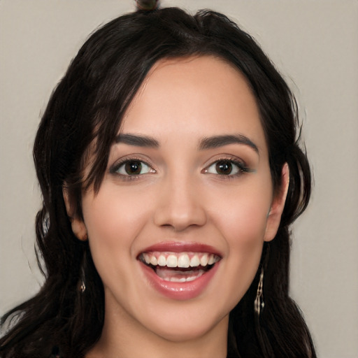 Joyful white young-adult female with long  black hair and brown eyes