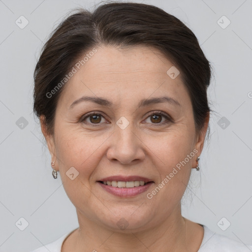 Joyful white adult female with short  brown hair and brown eyes