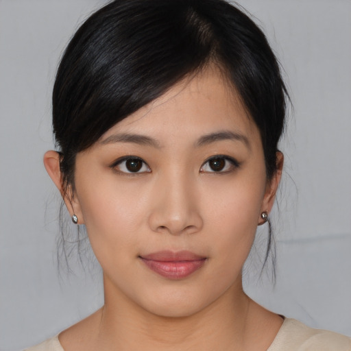 Neutral asian young-adult female with medium  brown hair and brown eyes