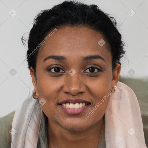 Joyful black young-adult female with short  brown hair and brown eyes