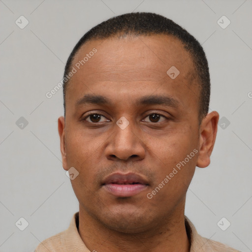 Neutral latino young-adult male with short  black hair and brown eyes