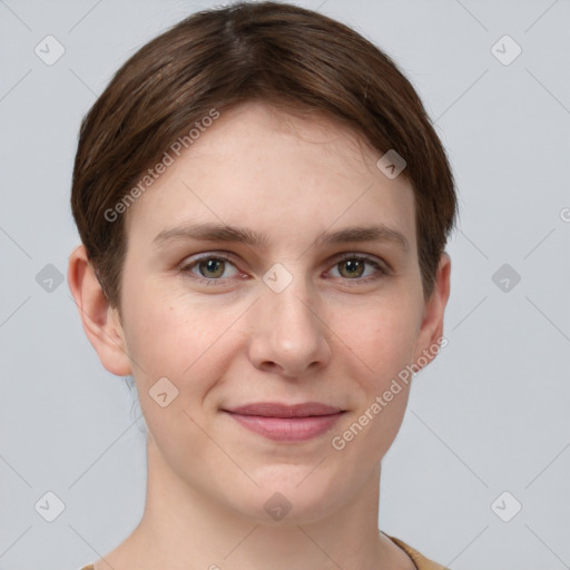 Joyful white young-adult female with short  brown hair and grey eyes